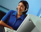 smiling female interviewer at computer